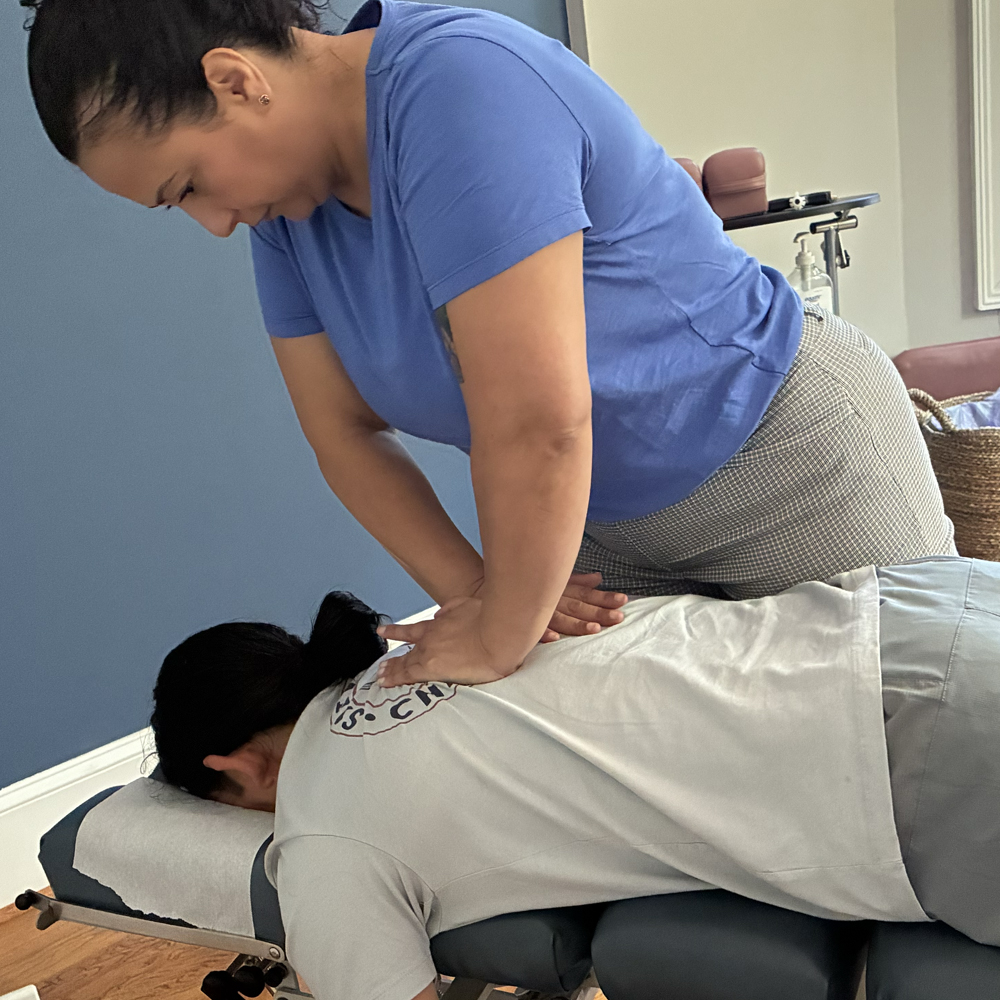 Manual chiropractic adjustment used to support spinal mobility.